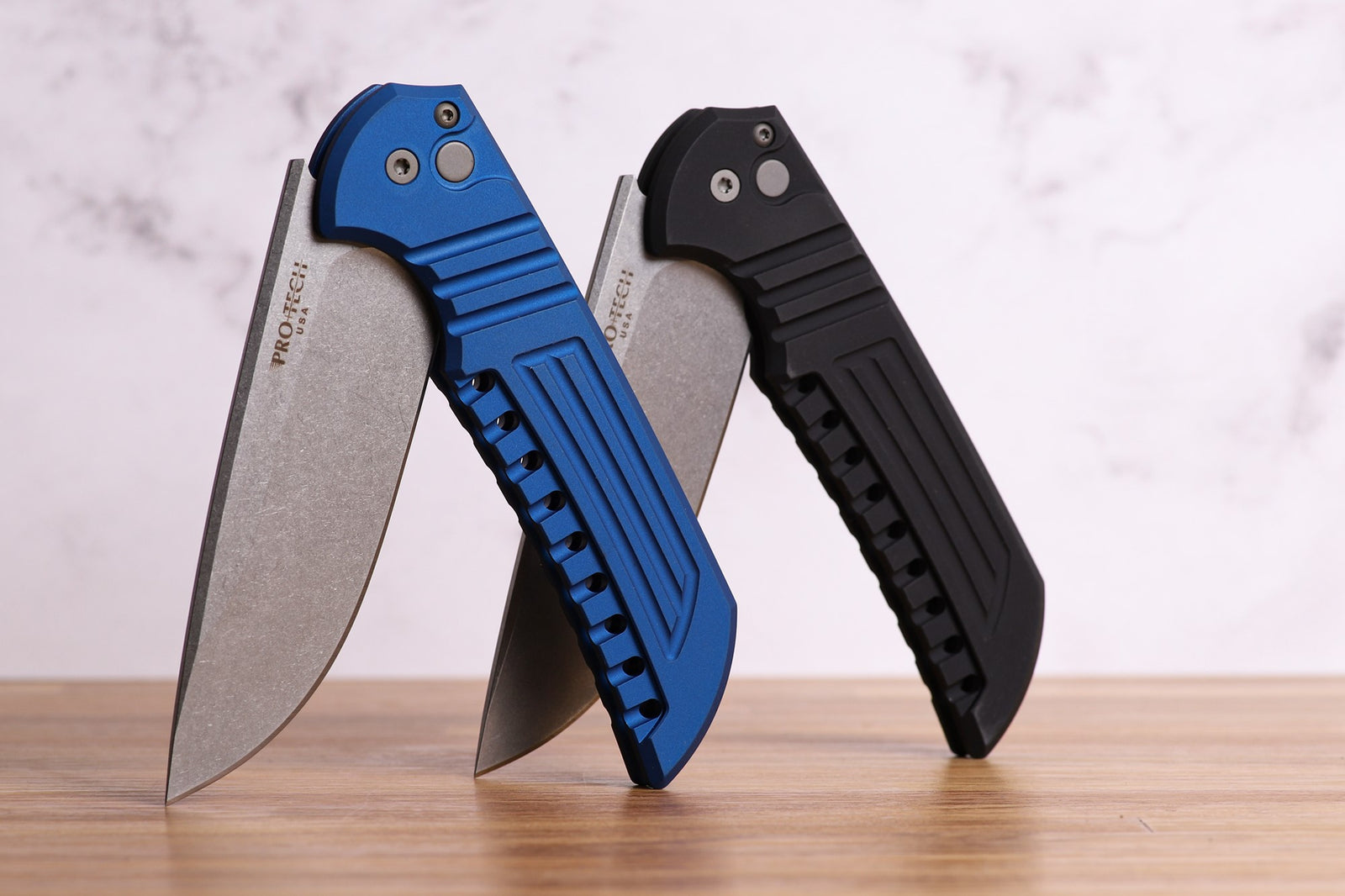 Pro-Tech Knives Mordax in Magnacut designed by Ferrum Forge with Aluminum milled handles and button lock stonewashed blade