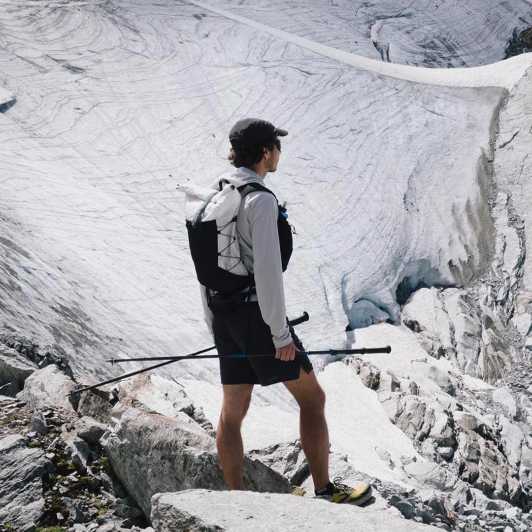 Bonfus Fastus 23L ultralight fastpacker being worn - hiker with compact DCF pack on mountain trail