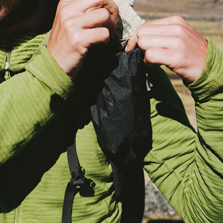 Bonfus Shoulder Pouch in use on trail - ultralight strap pocket attached to hiking backpack for easy access