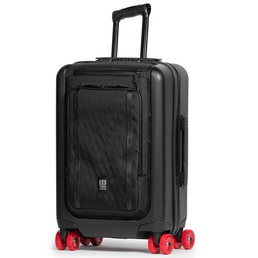 Topo Designs Global Pro Travel Roller in Black with red spinner wheels