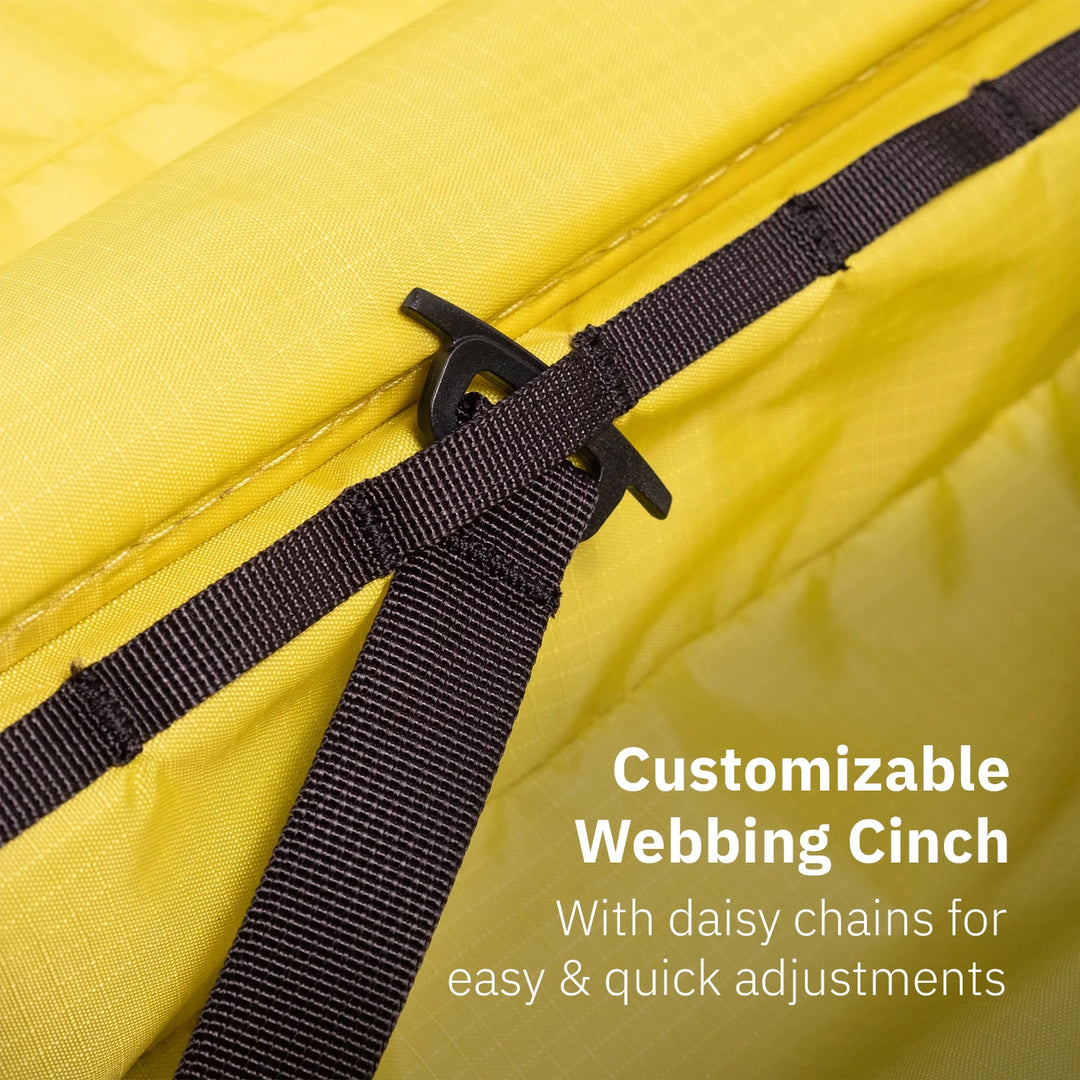 Close-up of customizable webbing cinch with daisy chains inside the Topo Designs Global Pro Travel Roller