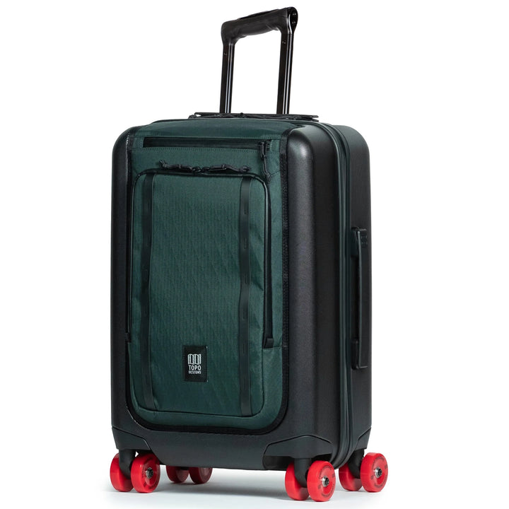 Topo Designs Global Pro Travel Roller in Dark Pine with black shell and red spinner wheels