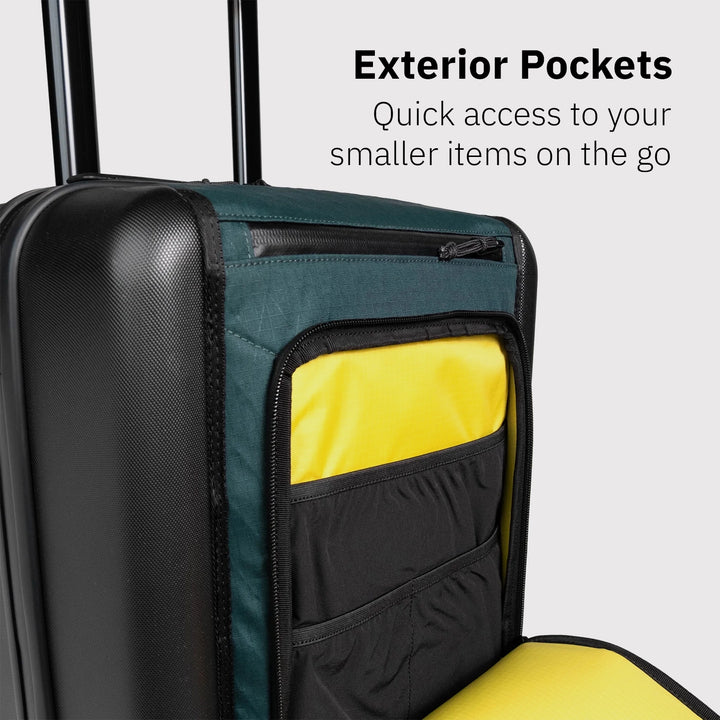 Topo Designs Global Pro Travel Roller showing exterior pockets for quick access to smaller items