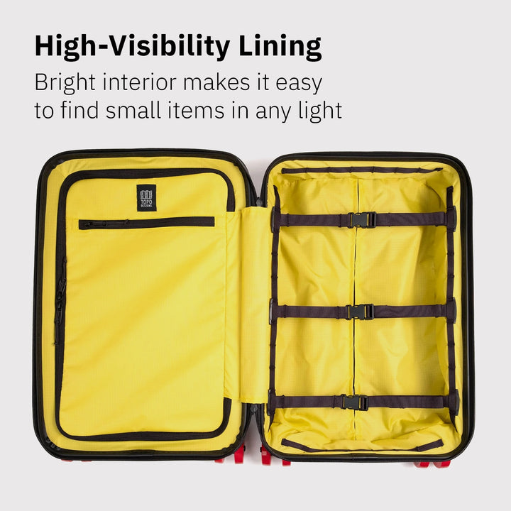 Topo Designs Global Pro Travel Roller open to show bright high-visibility interior lining and organization