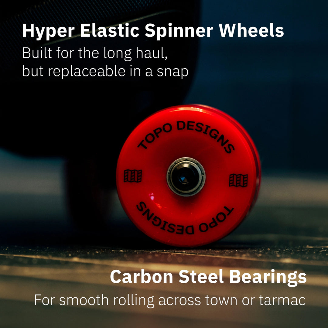 Close-up of Topo Designs Global Pro Travel Roller Hyper Elastic spinner wheel with carbon steel bearing