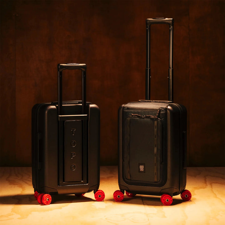 Topo Designs Global Pro Travel Roller shown from the back while extending the handle